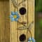 Glitzhome® 11.75" Yellow Washed 3D Metal Flowers Distressed Wood Cottage Birdhouse